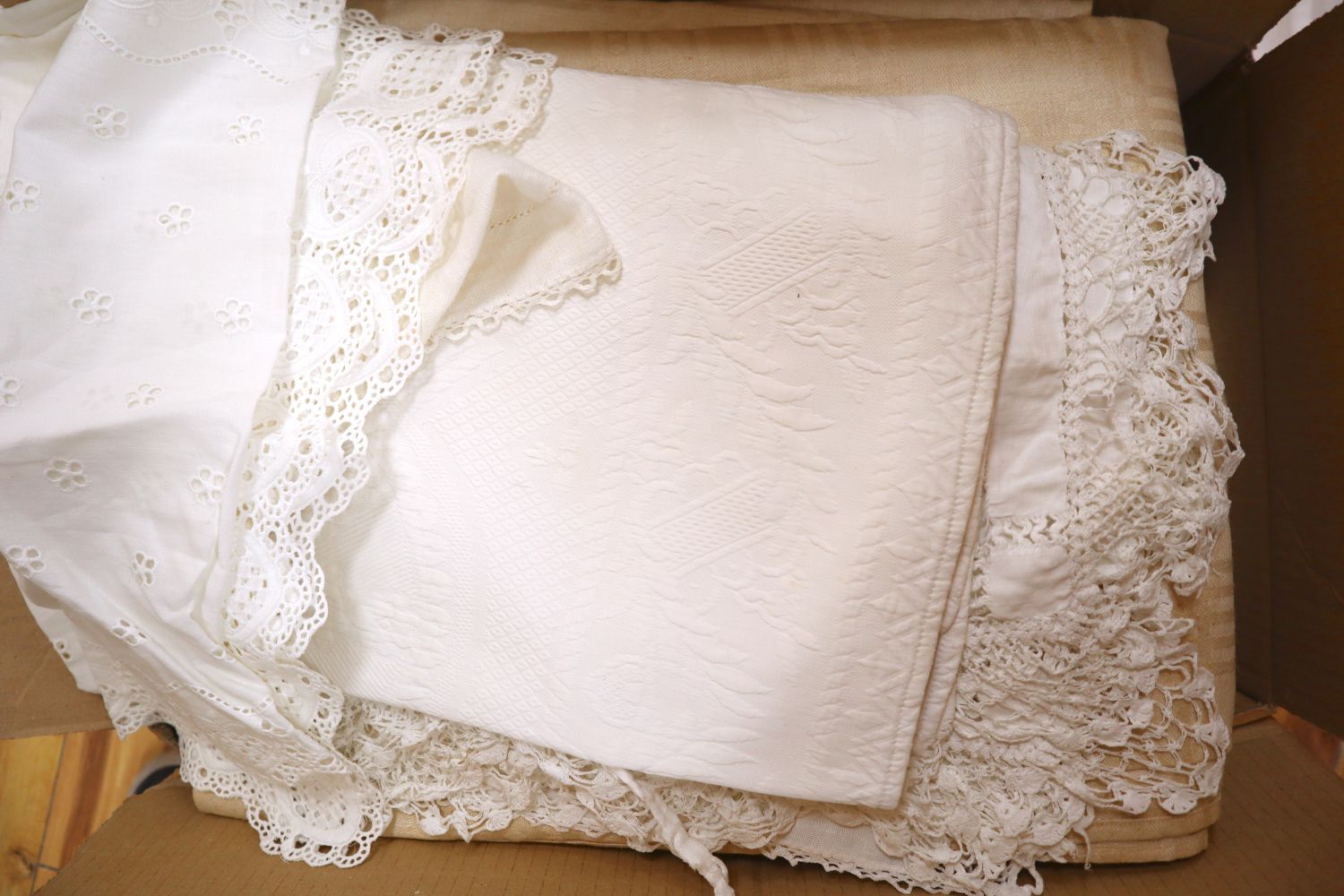 A quantity of white damask and crochet edged linen